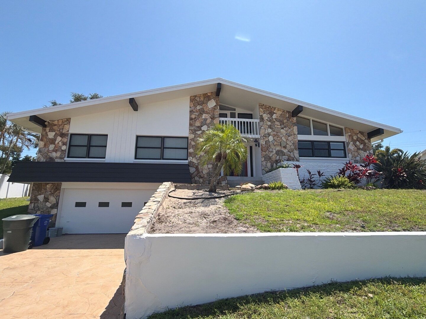 Dunedin Florida home after exterior painting by Highmark in white Sherwin-Williams Duration