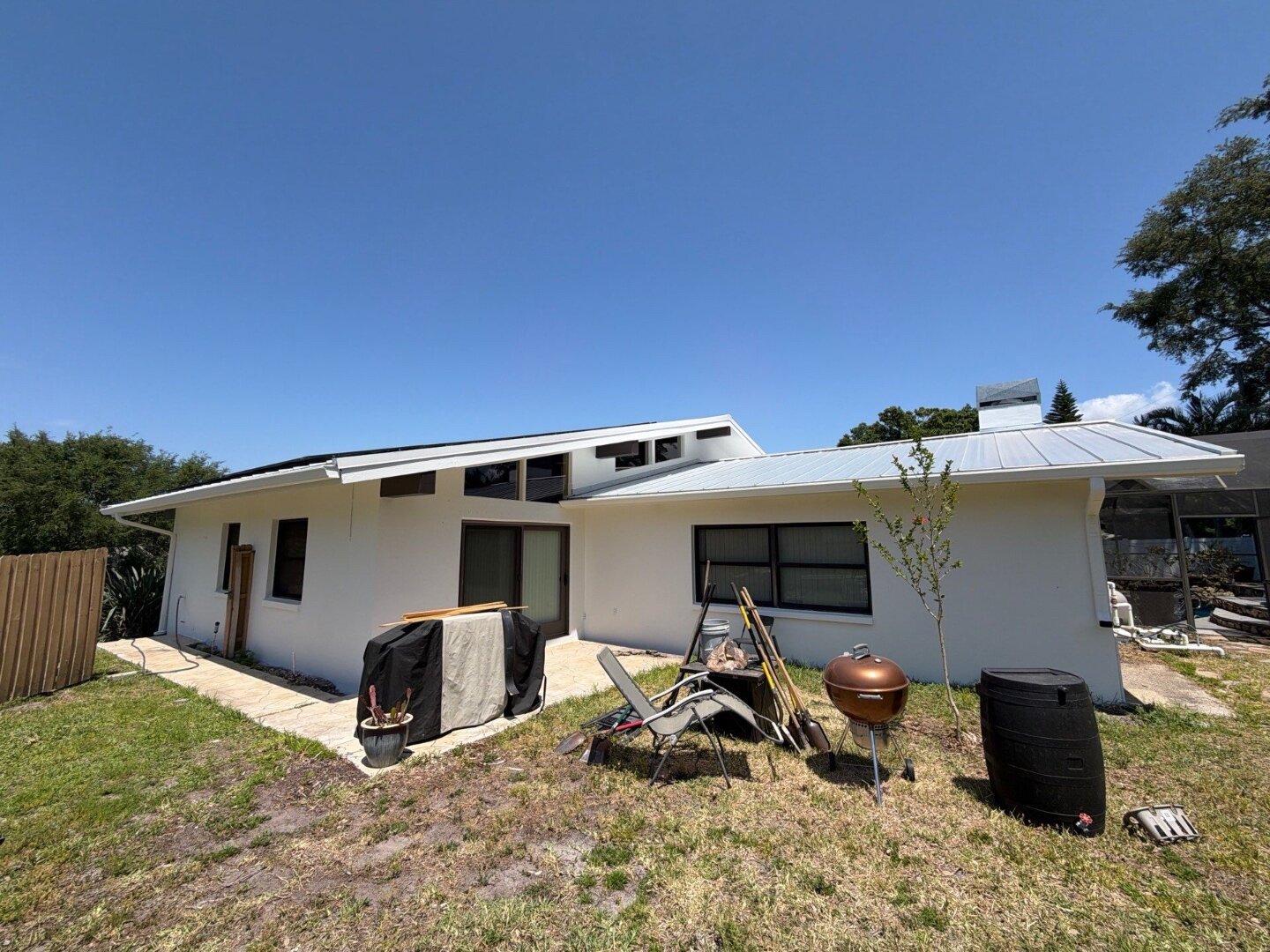 Dunedin home rear elevation after exterior painting in white by Highmark