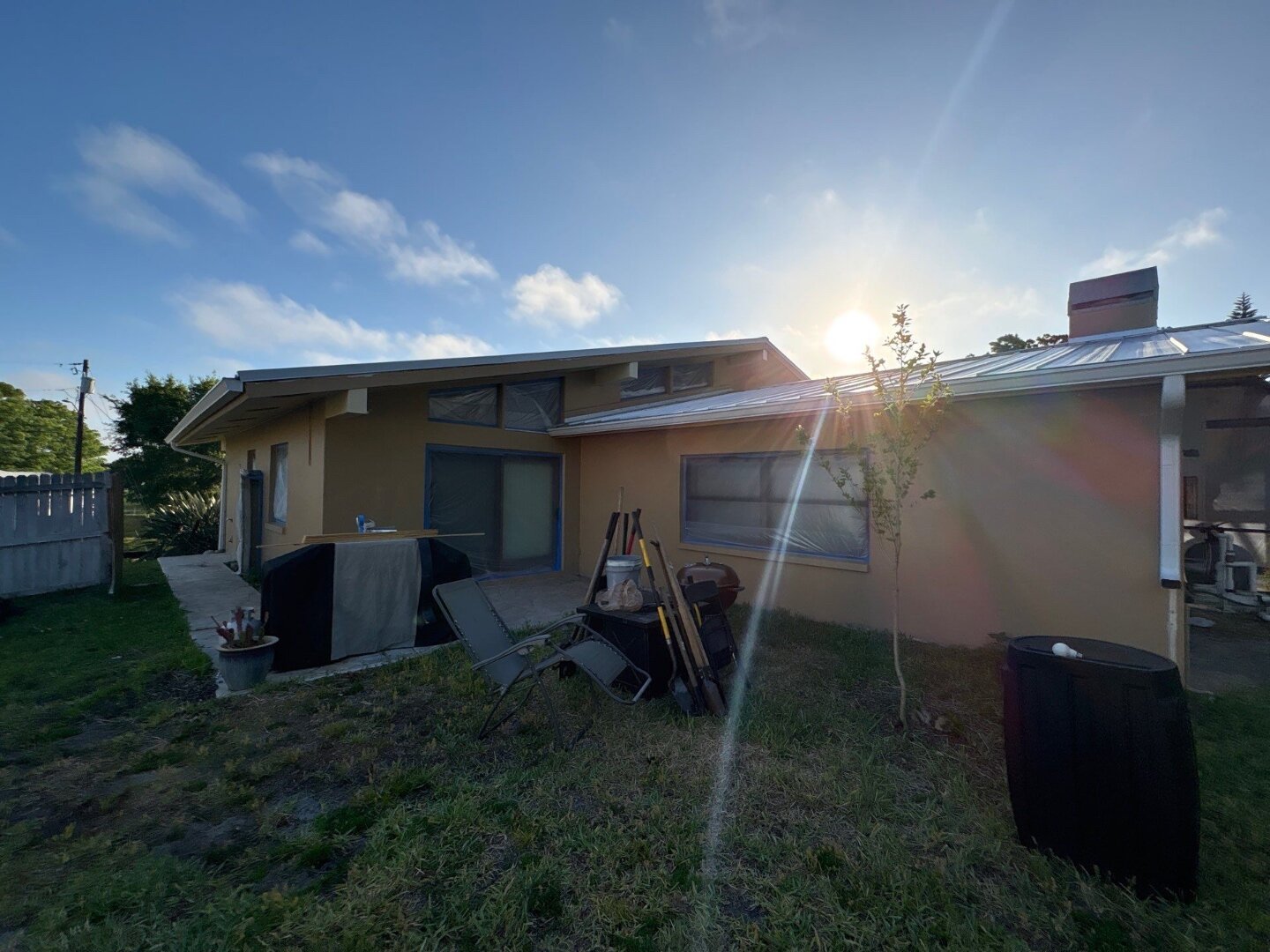 Dunedin home rear elevation before painting, original brown stucco